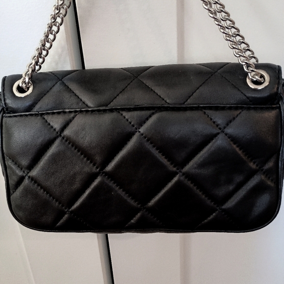 Michael Kors Quilted Black purse Perfect condition. Comes with a dust bag too! - Picture 2 of 7